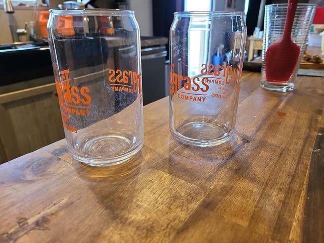 A reviewers two clear glass cups: one looking dirty without the pod and the other looking very clear with the pod
