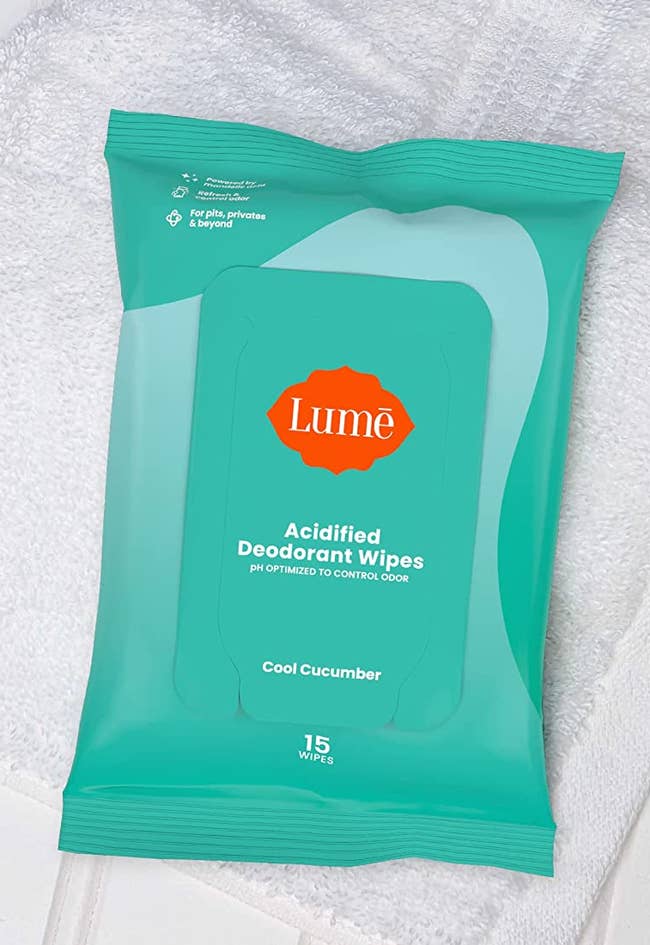 a green packet of the deodorant wipes 