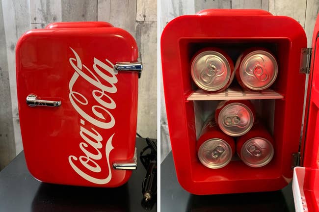 Reviewer image of red mini fridge that reads Coca-Cola, interior of products with cans on two shelves