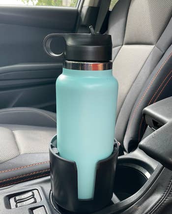 Reviewer's large water bottle in extended cupholder 