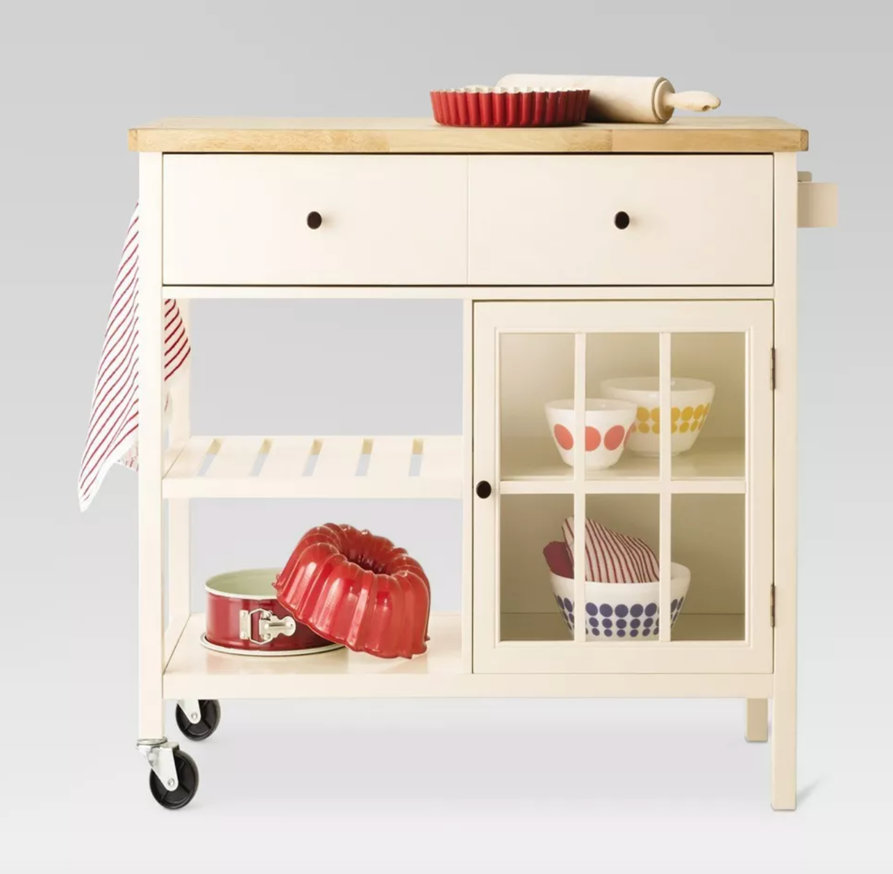 white kitchen island storing baking dishes