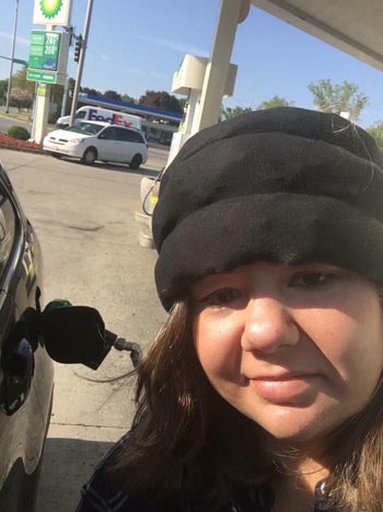 reviewer wearing the headache cap around their forehead