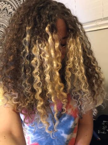Person with long curly hair 