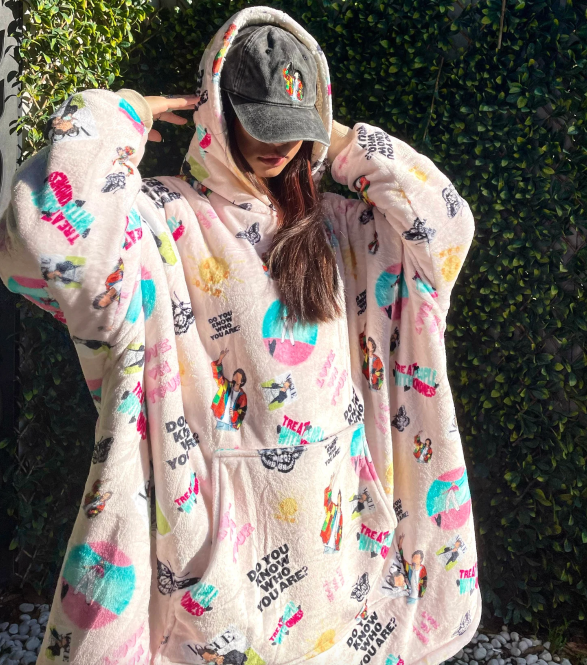 person wearing oversied blanket/hoodie