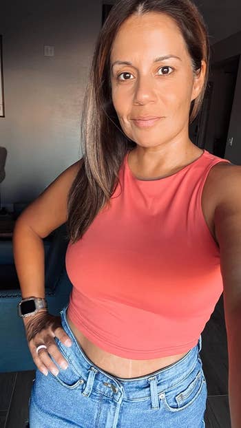 different reviewer wearing the top in coral