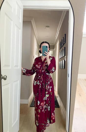 Reviewer in a red floral robe taking a mirror selfie