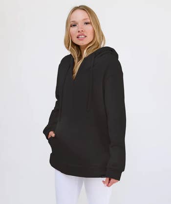 model wearing the black oversized hoodie