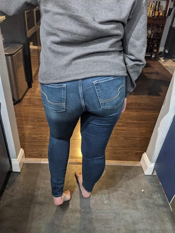 reviewer showing the back of the jeans