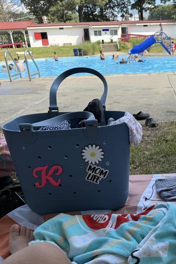 Poolside country with a tote container labeled