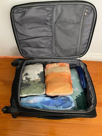 Lifestyle Open suitcase with packing cubes in it