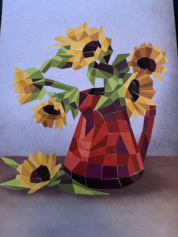 reviewer photo of a finished picture of a pitcher of sunflowers