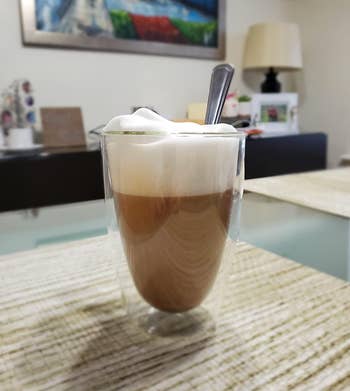 An espresso shot topped with foamy milk 