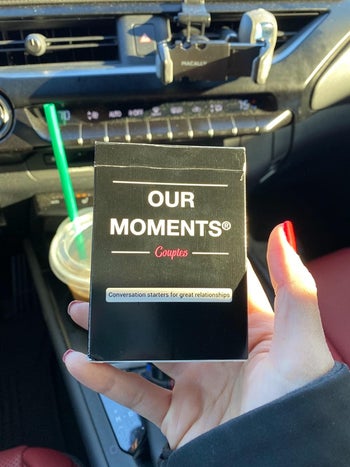 image of the card game in a reviewer's hand