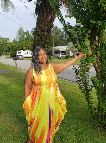 a reviewer wearing a spaghetti strap option of the maxi dress