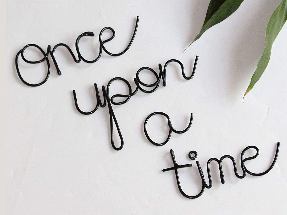 simple black wire decoration spelling out once upon a time in cursive