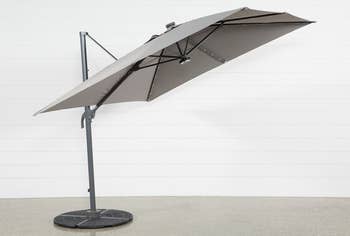 a gray cantilever umbrella