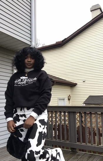 a different reviewer wearing black and white cow print