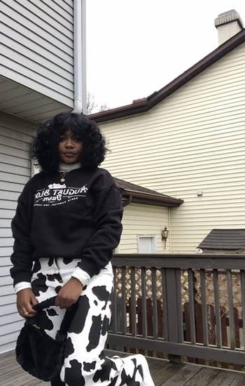 a different reviewer wearing black and white cow print