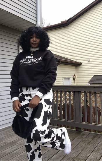 a different reviewer wearing black and white cow print