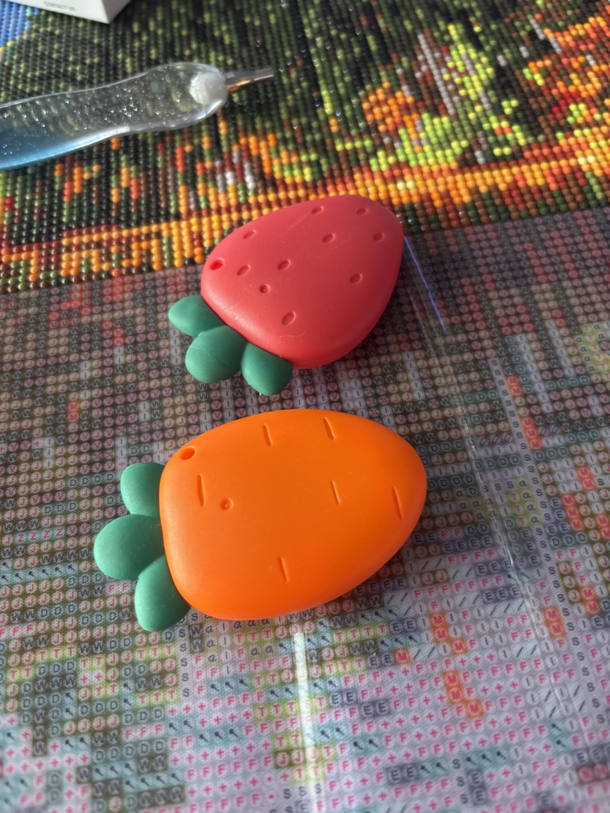  1  shaped similar  a reddish  strawberry and the different   similar  an orangish  carrot
