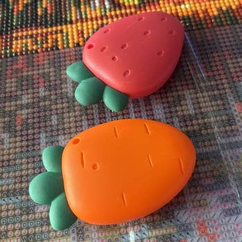 1 shaped similar a reddish strawberry and the different similar an orangish carrot