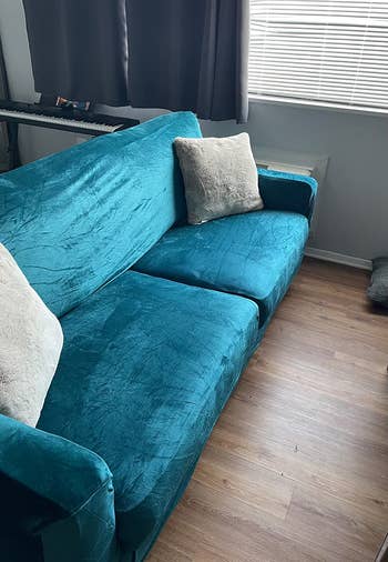 on right: same couch covered with blue velvet slip cover 