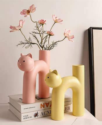 the pink and yellow cat shaped vases