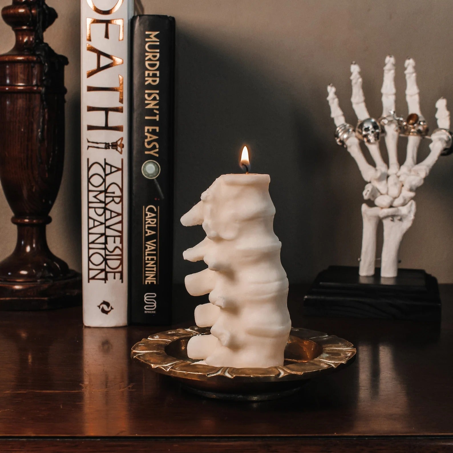 The lit candle in white