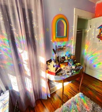 a room lit up by the rainbow decal