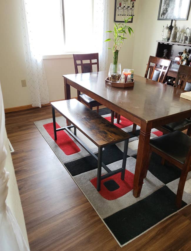 A reviewer's dining table with the benches underneath