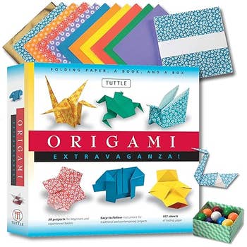 Origami kit box with colorful paper, origami examples like cranes and frogs, and a book included for projects and beginners