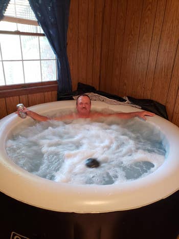 a reviewer sitting in the hot tub