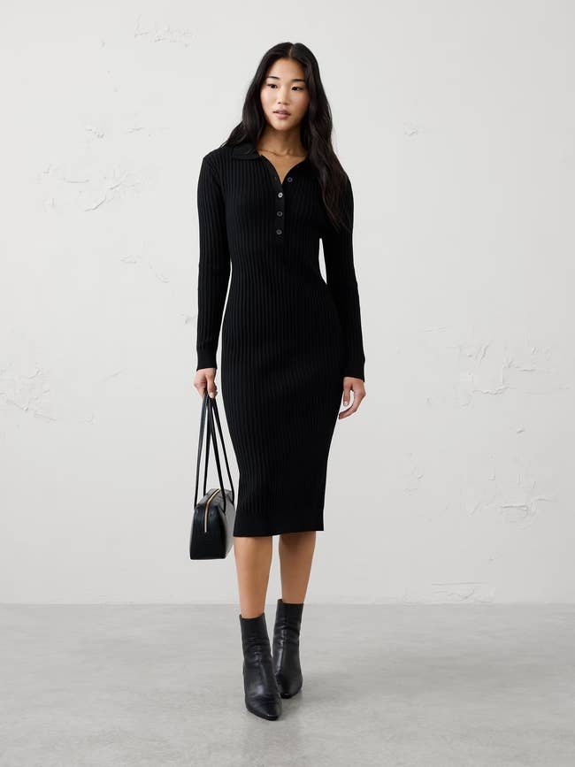 Person successful  a ribbed knit formal  with buttoned neckline, holding a handbag, wearing ankle boots