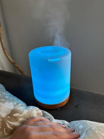 wood base diffuser with blue light