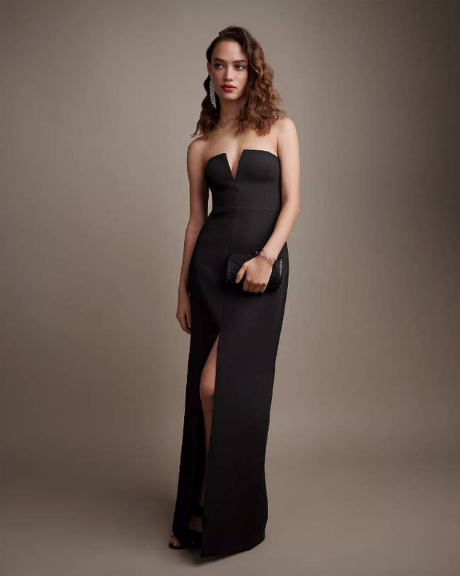 Image of model wearing long black dress