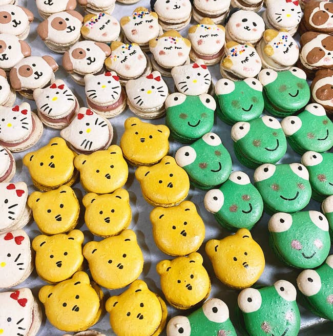 macarons shaped like pooh, frog, and hello kitty 