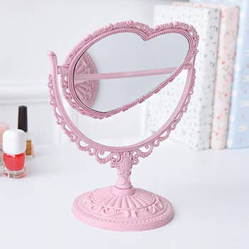 the pink heart shaped mirror