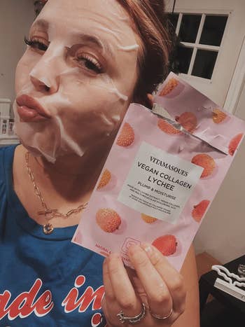 Person with face patches holding a collagen product package