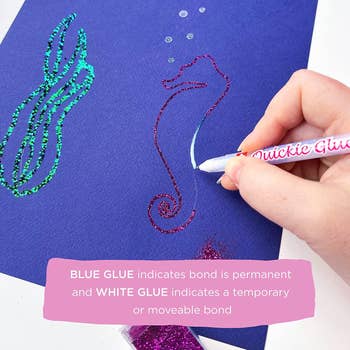 A hand drawing a seahorse with the glue that's then covered in glitter