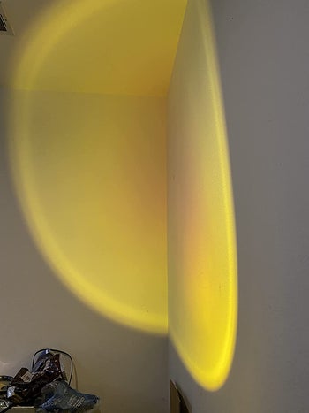 reviewer photo of yellow sunset light projected onto wall