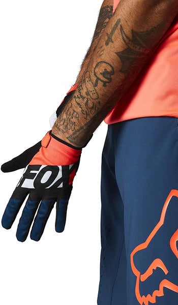 lifestyle photo of model putting on Fox bike glove