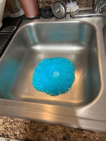 a reviewer's sink with blue foam in it