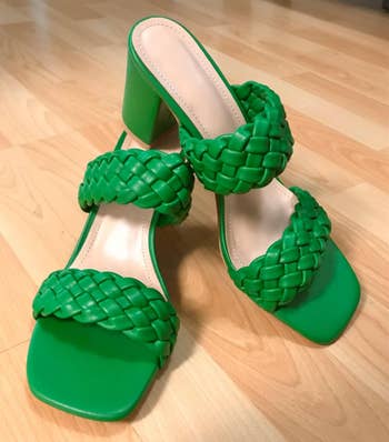 A pair of green braided high-heel sandals 