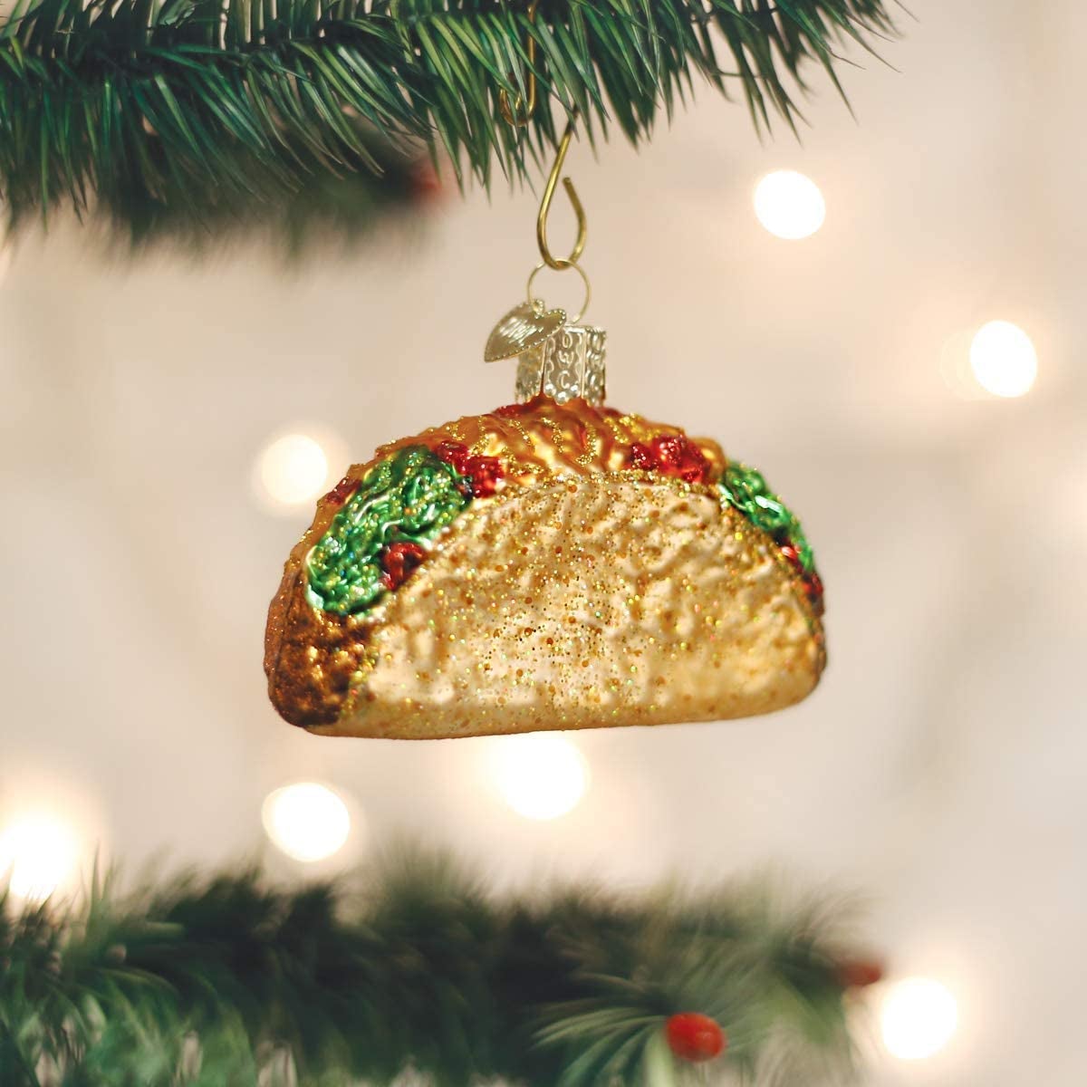 a glass blown ornament of a taco
