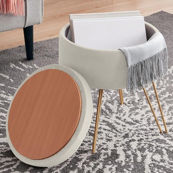 cream colored storage ottoman