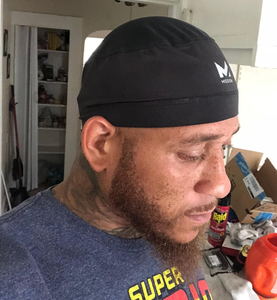 Reviewer showing side profile of hat 