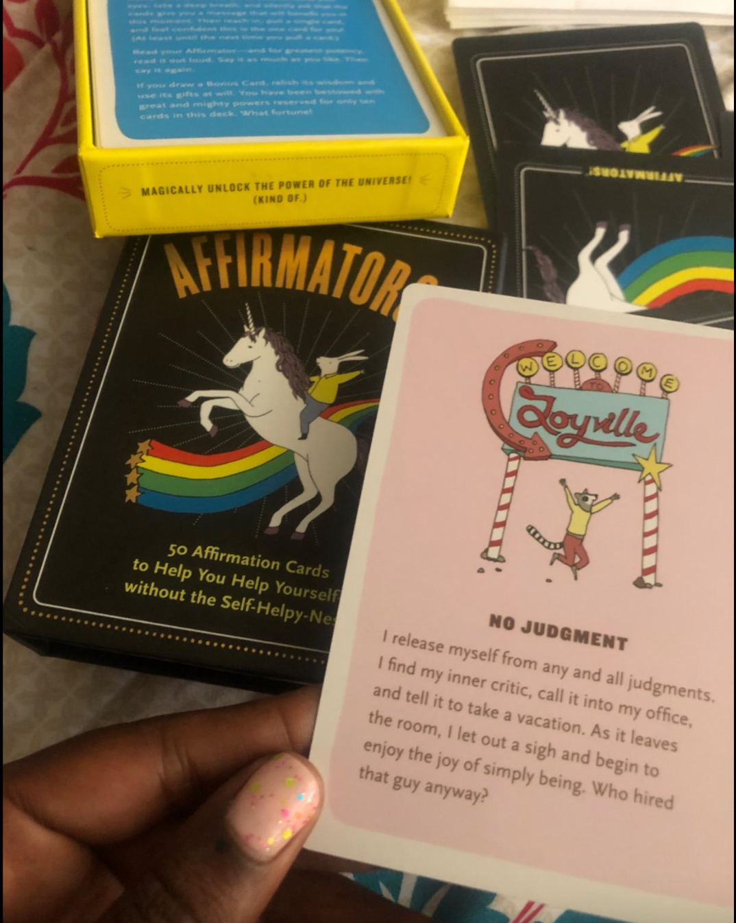Reviewer holding an illustrated affirmation card 