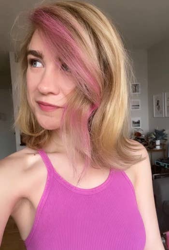 BuzzFeeder with pink streaks on blonde hair 