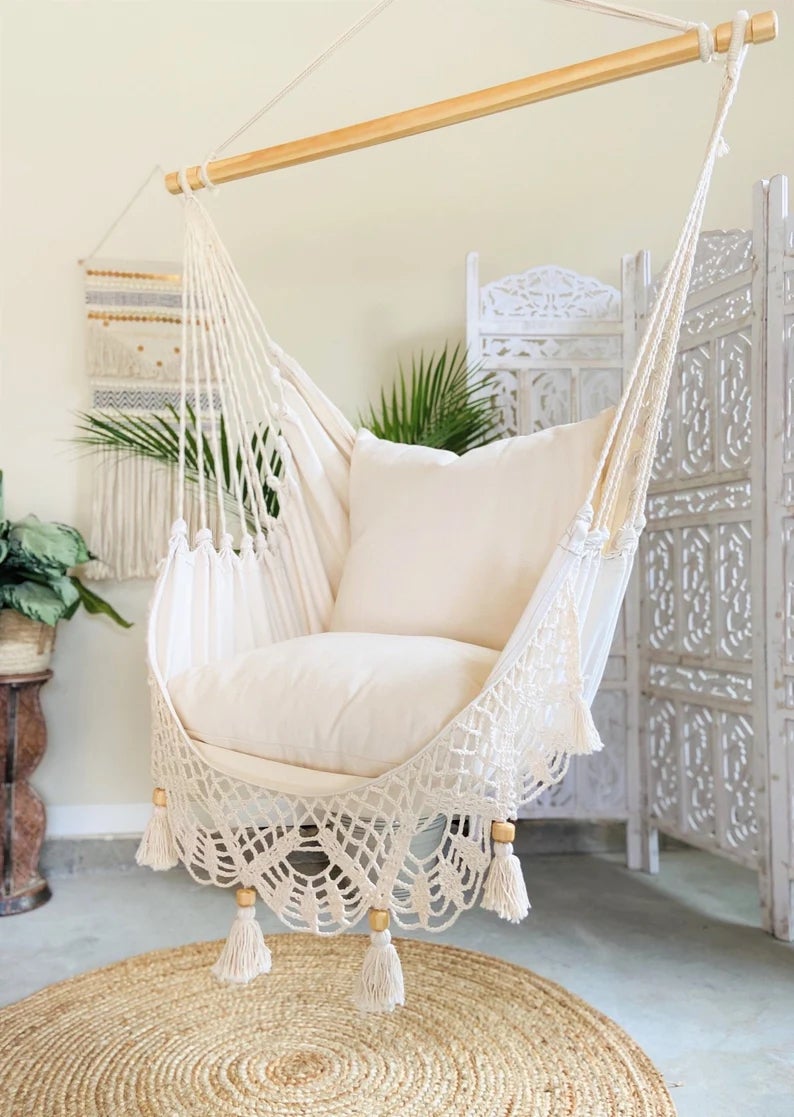 a white crochet hanging hammock chair