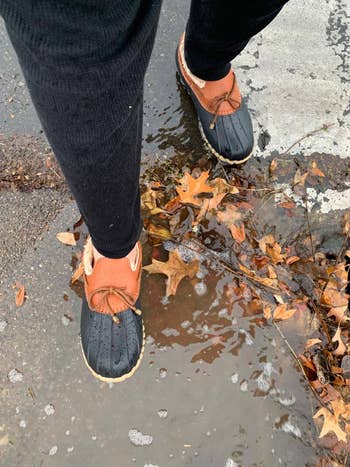 reviewer stepping in a puddle wearing the duck loafers
